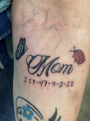 Mom with a ladybug & butterfly & my mom's birthday and death date.