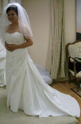 wedding dress alterations - added bustle, tucked in bust, hemmed length