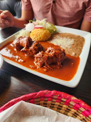 Barbacoa de chivo with rice, beans and corn tortillas.