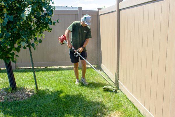 Our weekly mowing service includes line trimming along fences lines, trees, hardscapes and landscape beds.