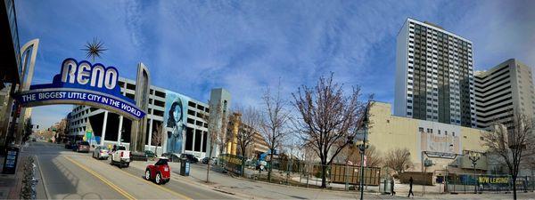 Panorama of Reno Arch, plaza, and two towers of Reno City Apartments