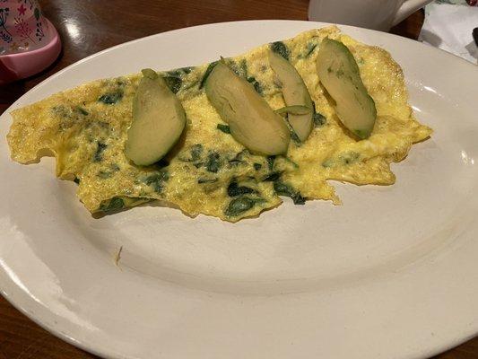 Spinach cheese and avocado omelette. Flat, tasteless, traces of cheese.