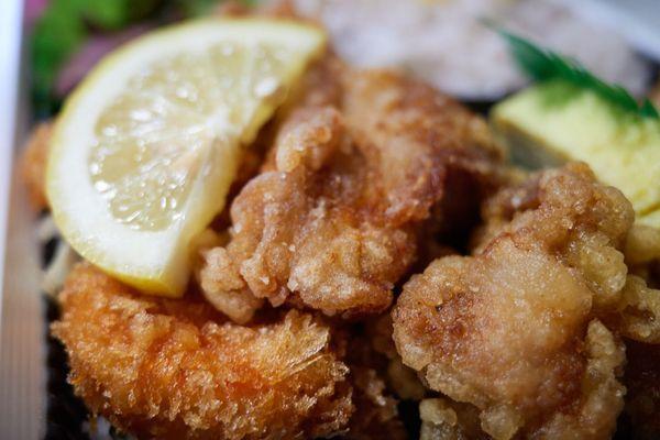 Shrimp and chicken karaage bento - close-up shrimp (L), karaage (R)