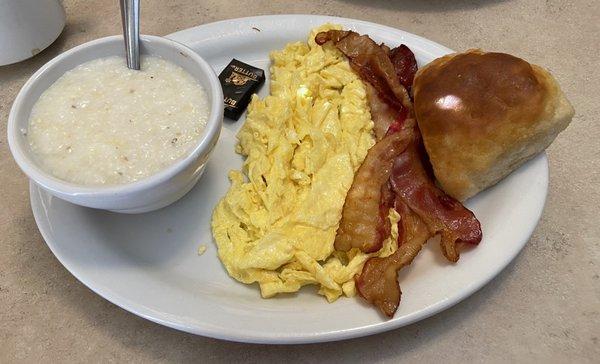 Two eggs (scrambled) with grits, a biscuit, and bacon