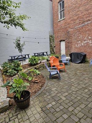 Cute private patio. Co-owner says they can host company meetings or private parties back here