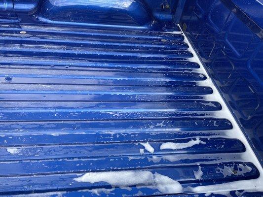 Soap and water left in bed of truck