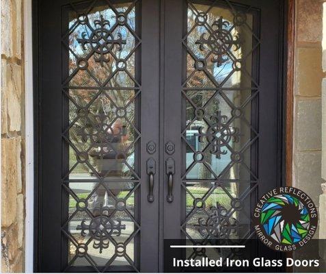 Installed glass in iron entry door