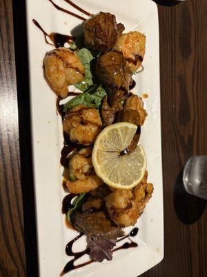 Stan The Man Grilled Shrimp. Seasoned Medium Rare Ribeye Bites. Balsamic Drizzle. Served Over a Bed of Spinach.