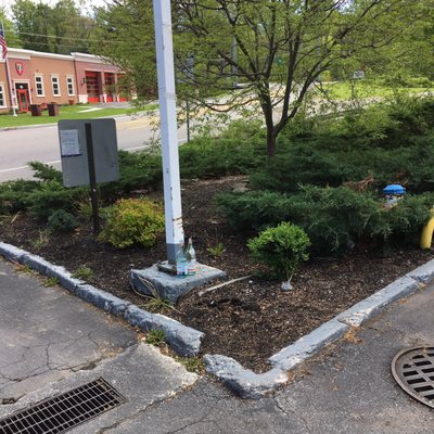 The two glass bottles at the bottom of the light post have been there for over two weeks!! And there is garbage everywhere!