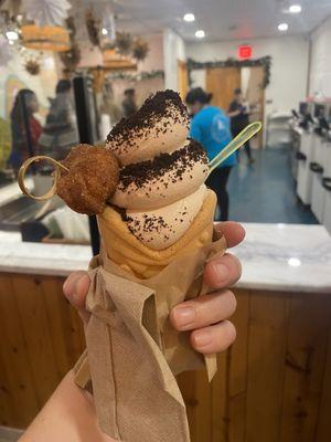 Holiday special of gingerbread ice cream with Oreo powered toppings and the cone is lined with cookie butter!