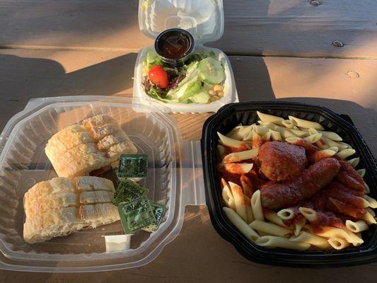 Penne with meatballs and sausage, salad, bread.