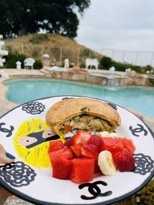 Organic chicken pot pie with fresh watermelon strawberry banana fruit salad