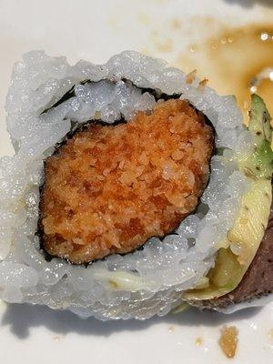 Spicy Tuna Roll WAS filled with fillers! The tiny red specks you see are the tuna. The rest is all panko. It's terrible!