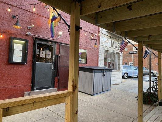 Outdoor dining has a roof.