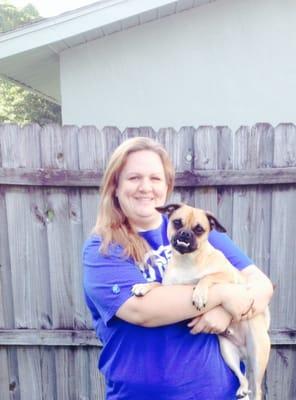 Megan is one of our senior Vet Techs posing with one of her many 4-legged babies!