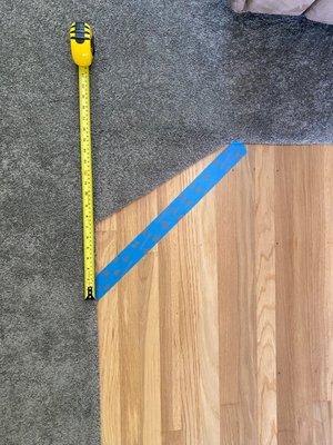 Transition from carpet to hardwood was done incorrectly and not per my measurements or angle