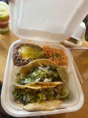 Carnitas street tacos and beans and rice