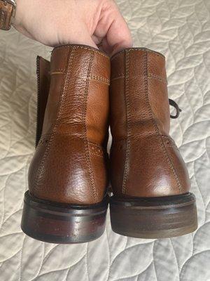 Left- original boot (we have a backup pair and were able to compare), Right- dull redone heel. Lacks same craftsmanship.