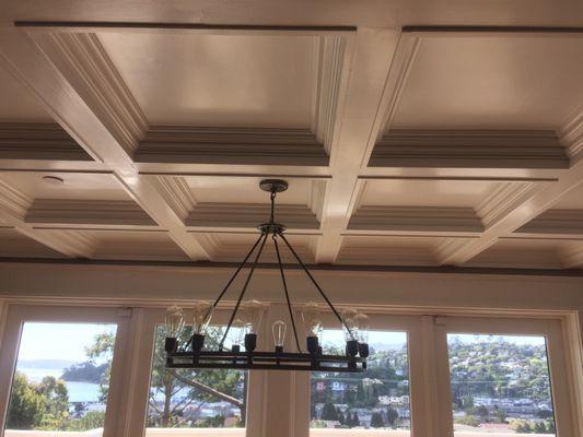 Coffered ceiling with nice chandelier.