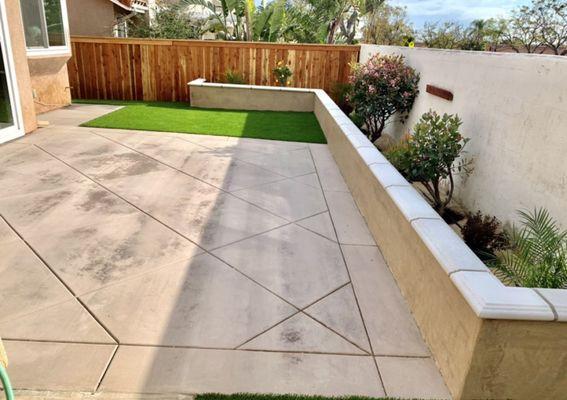 Small retaining wall with turf and new concrete installation