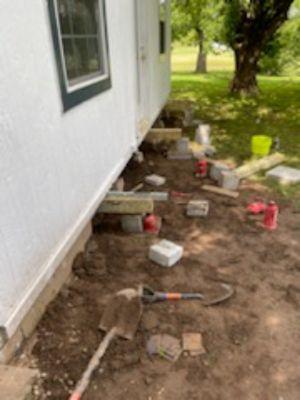 Crawl space foundation being leveled.