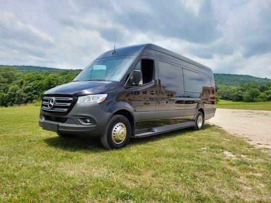 14 passenger limousine style Mercades Sprinter