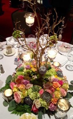 Classic Dinner Centerpiece ... Roses, Succulents, hydrangea with Curly Willow and Candles hanging....