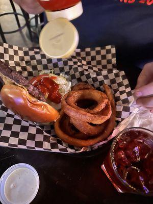 Greasy onion rings and leather burger