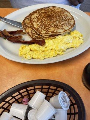 This plate is called the breakfast special . 2 pancakes, 2 bacon & 2 eggs.