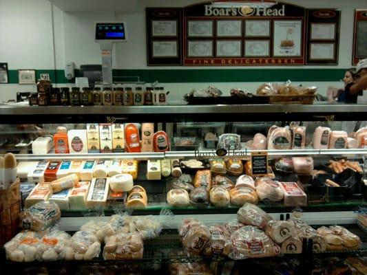 The deli meats and sandwiches case