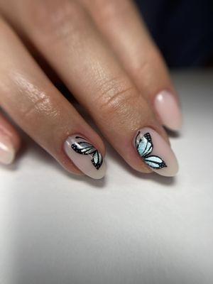 Gel manicure with butterfly design