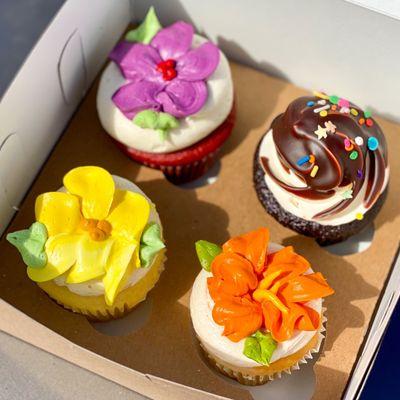 Top row, L to R: Red Velvet and Chocolate Ganache cupcakes Bottom row, L to R: Lemon and Orange cupcakes