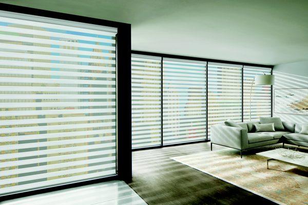 Get layers of light control with Designer Banded Shades.