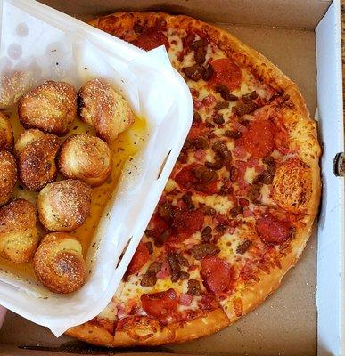 Meat lovers pizza and garlic knots