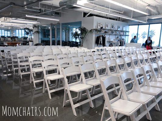 Setup by Mom Chairs for a company gathering (Pictured: White resin folding chairs)