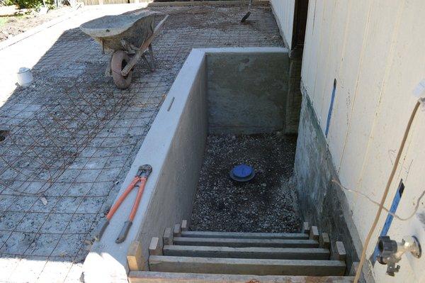 Retaining wall poured, getting ready for stairs and pad.