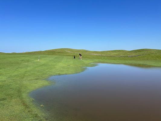 Water feature in the middle of the fairway. Water in all the bunkers. Place is disgusting.