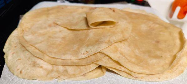 Customer gave me this tip. Unstacking the fresh tortillas like this helps keep them from sticking together later.