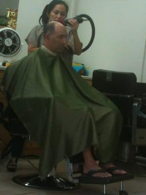 My dad getting his hair buzzed to a #2 level.