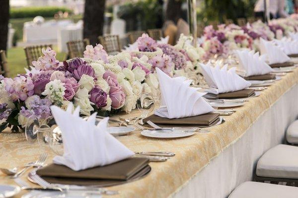 Flowers for Wedding Receptions and Special Events. Table centerpieces with lush floral elements.