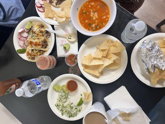 Menudo con pata and menudo sin pata are pictured in this photo. As well as a taco combination meal and burrito! All so good!