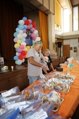 Our amazing volunteers selling delicious hamantashen!