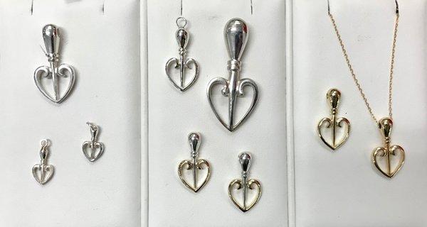 We have various sizes and metals of our signature charm, Heart Like an Awl