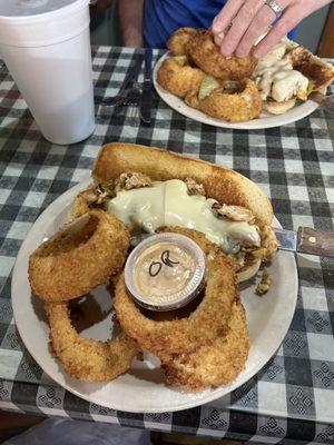 Chicken Philly with onion rings.