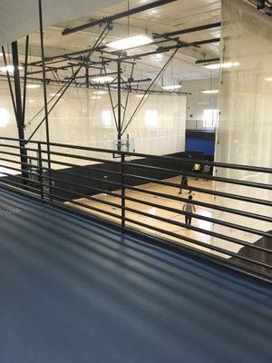 Indoor Run/walk track with views of the basketball courts.