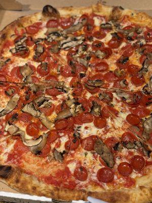 Pepperoni Pie with mushrooms before its end