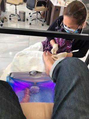 Pedicure - cleaning the cuticles