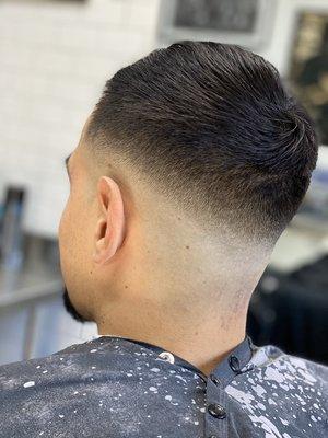 mid skin fade scissored comb over