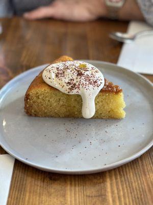 Olive oil cake: Light and airy olive oil cake served with whipped Creme Fraiche and Sumac.