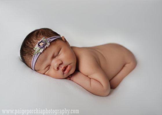 Newborn Girl on White Seamless and flower Headband